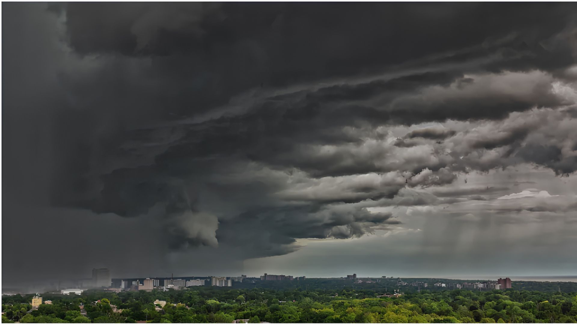 Dramatic storm clouds gathering over a residential cityscape with dark skies and rain shafts