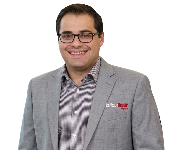 Professional man wearing gray blazer and checkered shirt smiling at camera Headshot