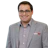 Professional man wearing gray blazer and checkered shirt smiling at camera Headshot